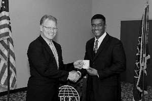 Mark Witzel (l), chapter president, presents a token of appreciation to Pete Copeland, assistant chief of staff, Communication Information Systems Department, Marine Corps Base Camp Pendleton, in January.